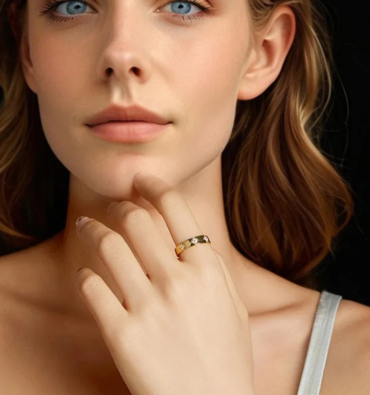 Gold plated sterling silver moissanite wedding ring on finger simple style