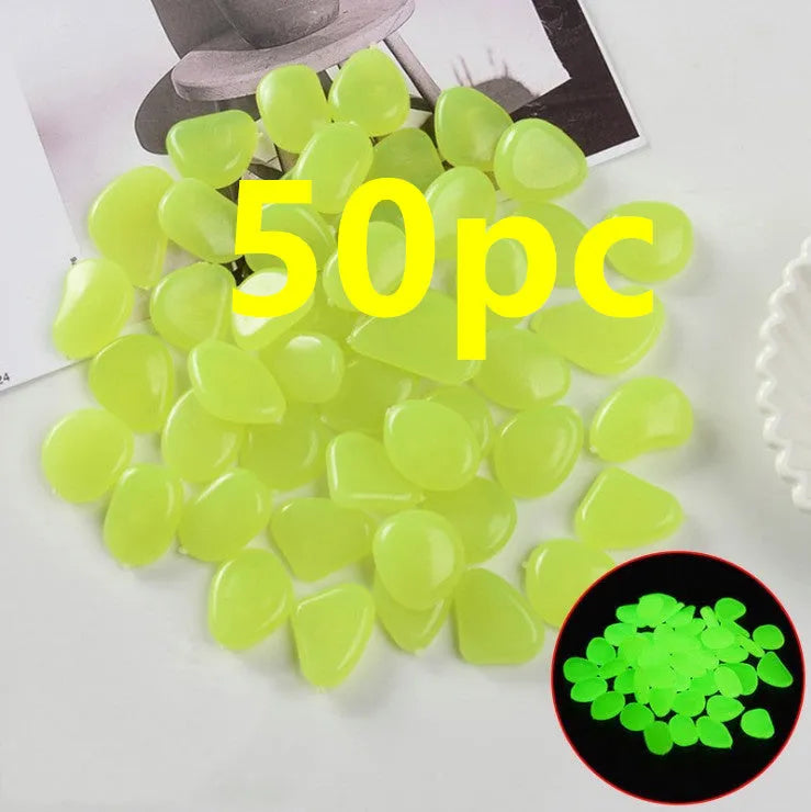 Luminous fluorescent aquarium and garden pebbles in mixed colours including dark purple, yellow, light blue, pink, orange