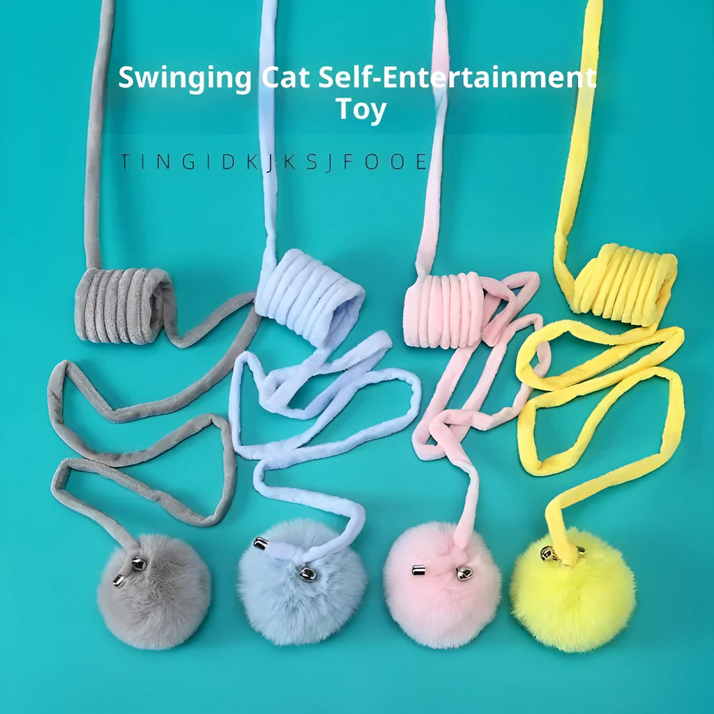 Blue cat toy with suction cup, spring rabbit fur ball, and retractable elastic rope on a door surface