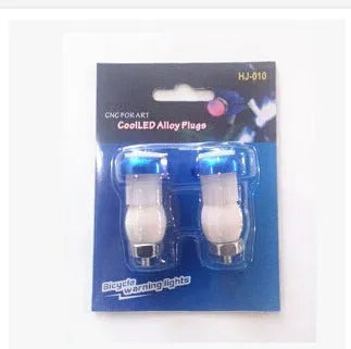 A pair of anodised aluminium bicycle handlebar safety lights in a choice of colours, showing the LED lens and mounting nut.