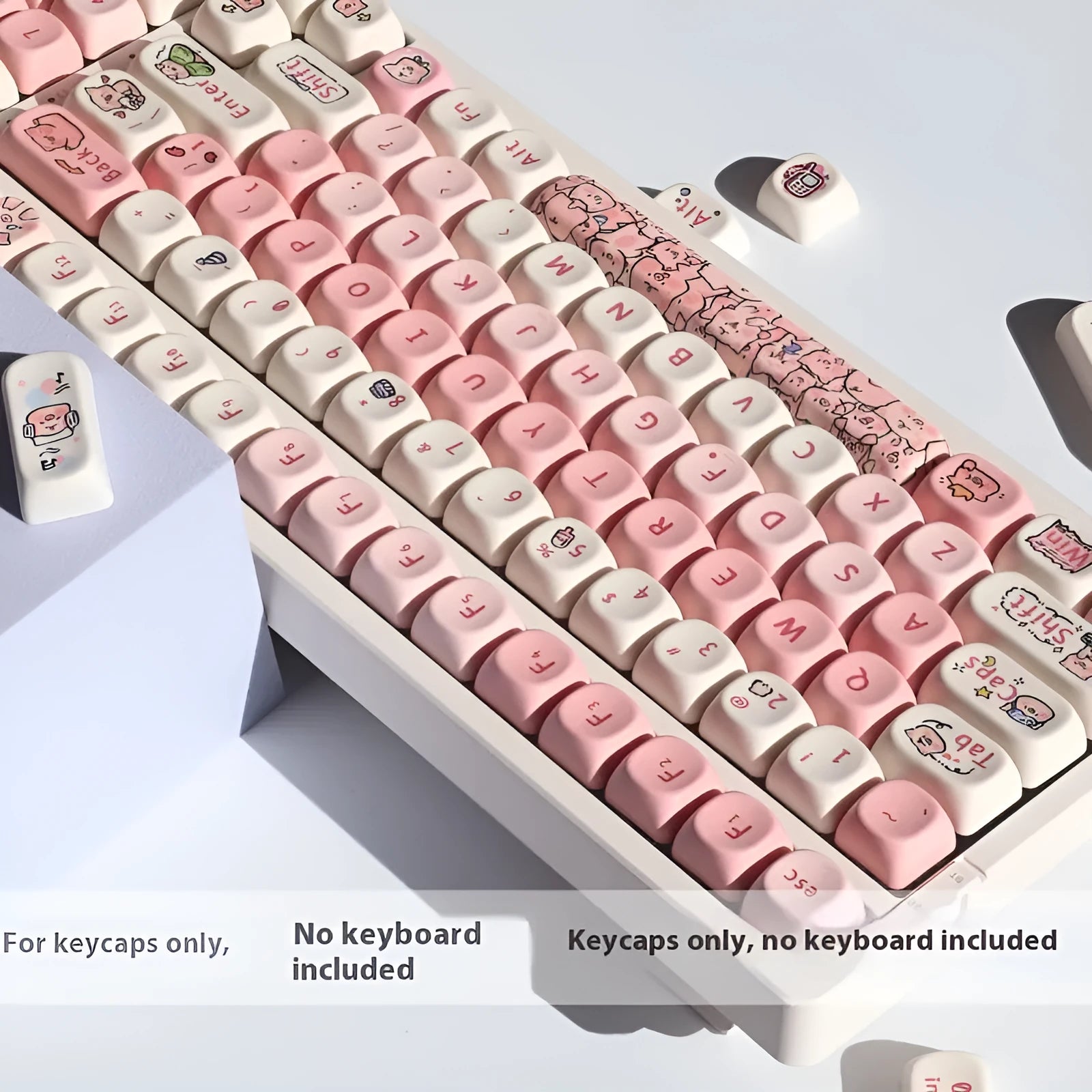 Pink PBT key cap with fragrant pig design on all five sides, shown with keycap puller tool