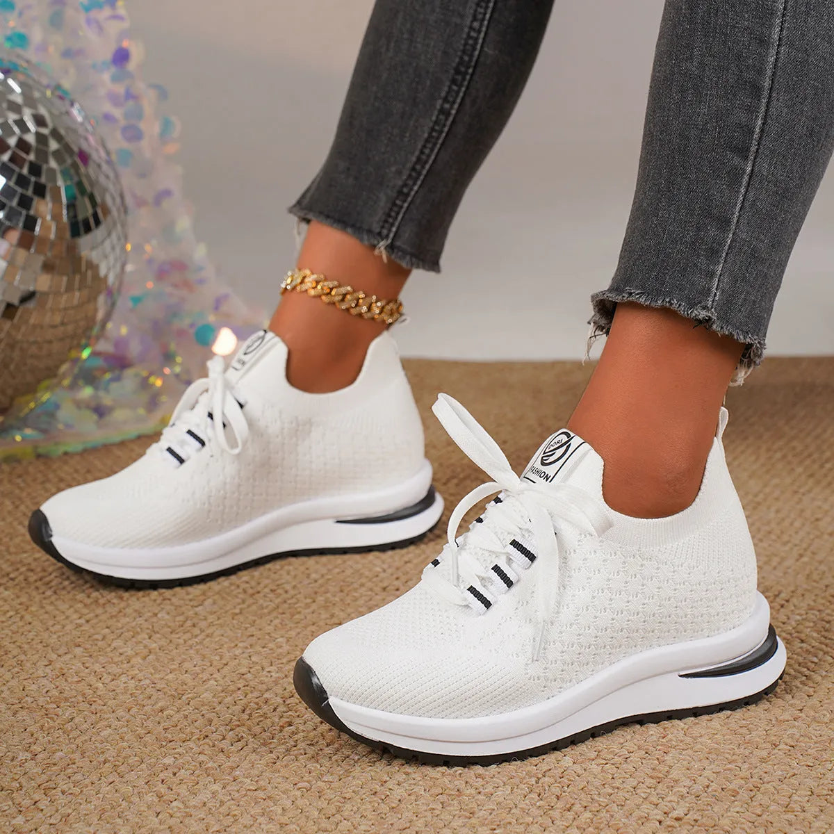 Women's black mesh lace-up flat pumps with round toe and rubber sole on white background