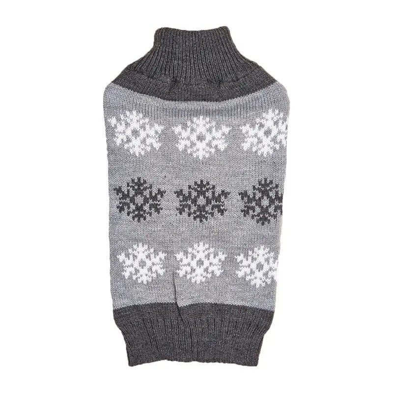 Grey dog sweater with white snowflake pattern on a small dog, showing knitted acrylic texture.