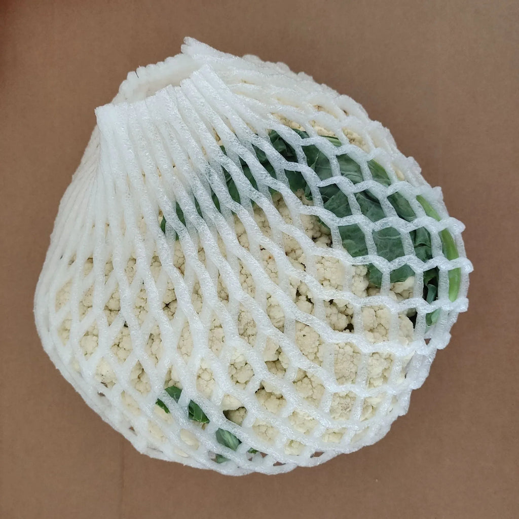 White foam protective net cover for apples, pears, peaches and oranges.