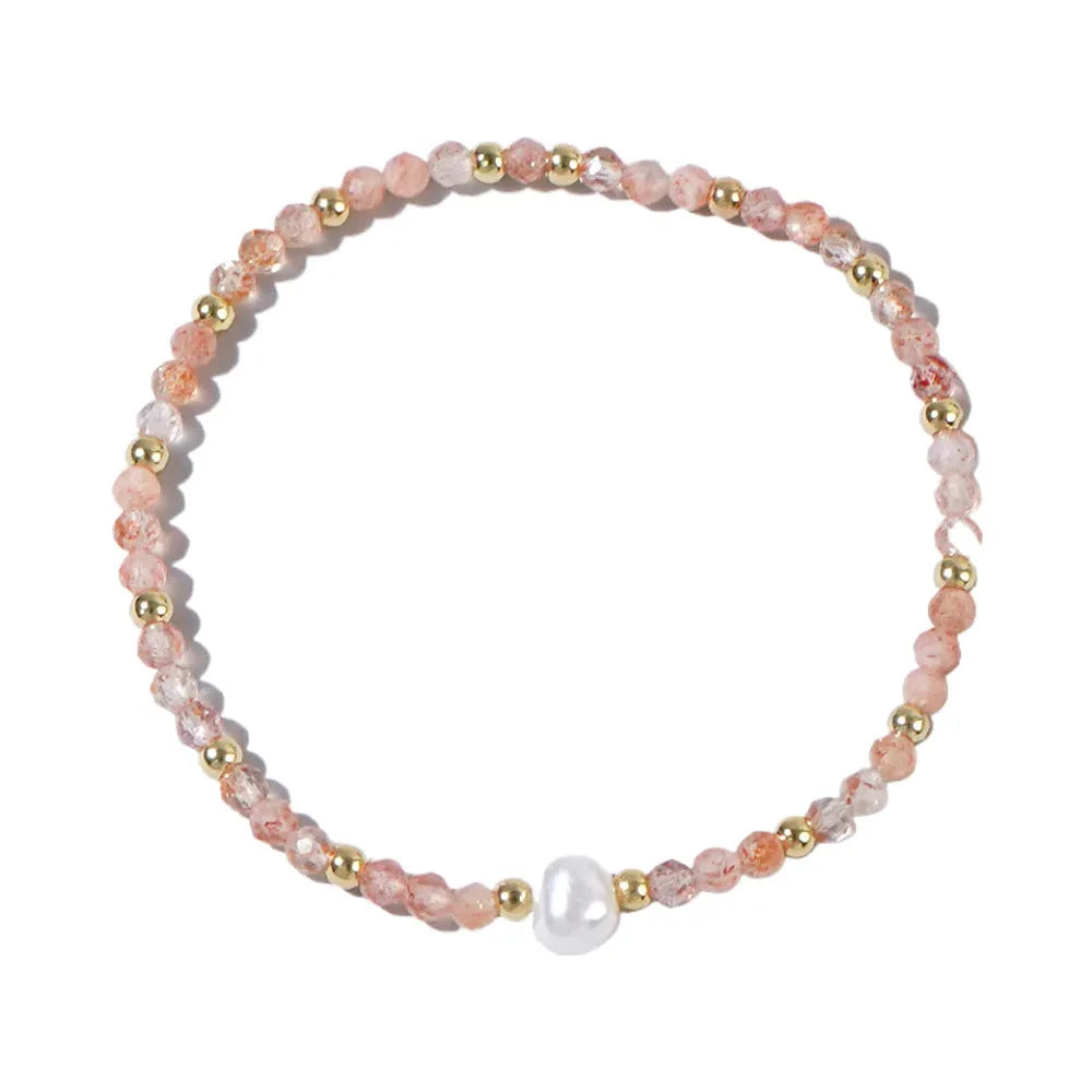 Close-up of a unisex natural stone bracelet with geometric ellipse beads on a wrist.