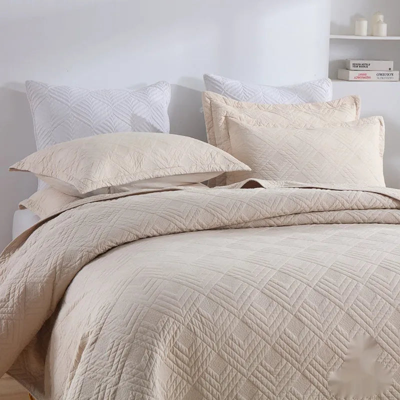 Pure cotton bed cover three-piece set shown in a light colour on a bed, featuring a quilt cover and sheet.