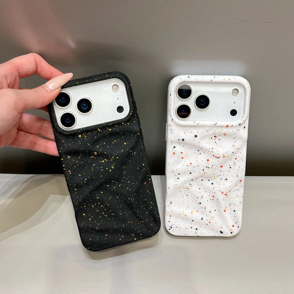 TPU phone case with splash ink pattern in black fitted on an iPhone showing the camera cutout