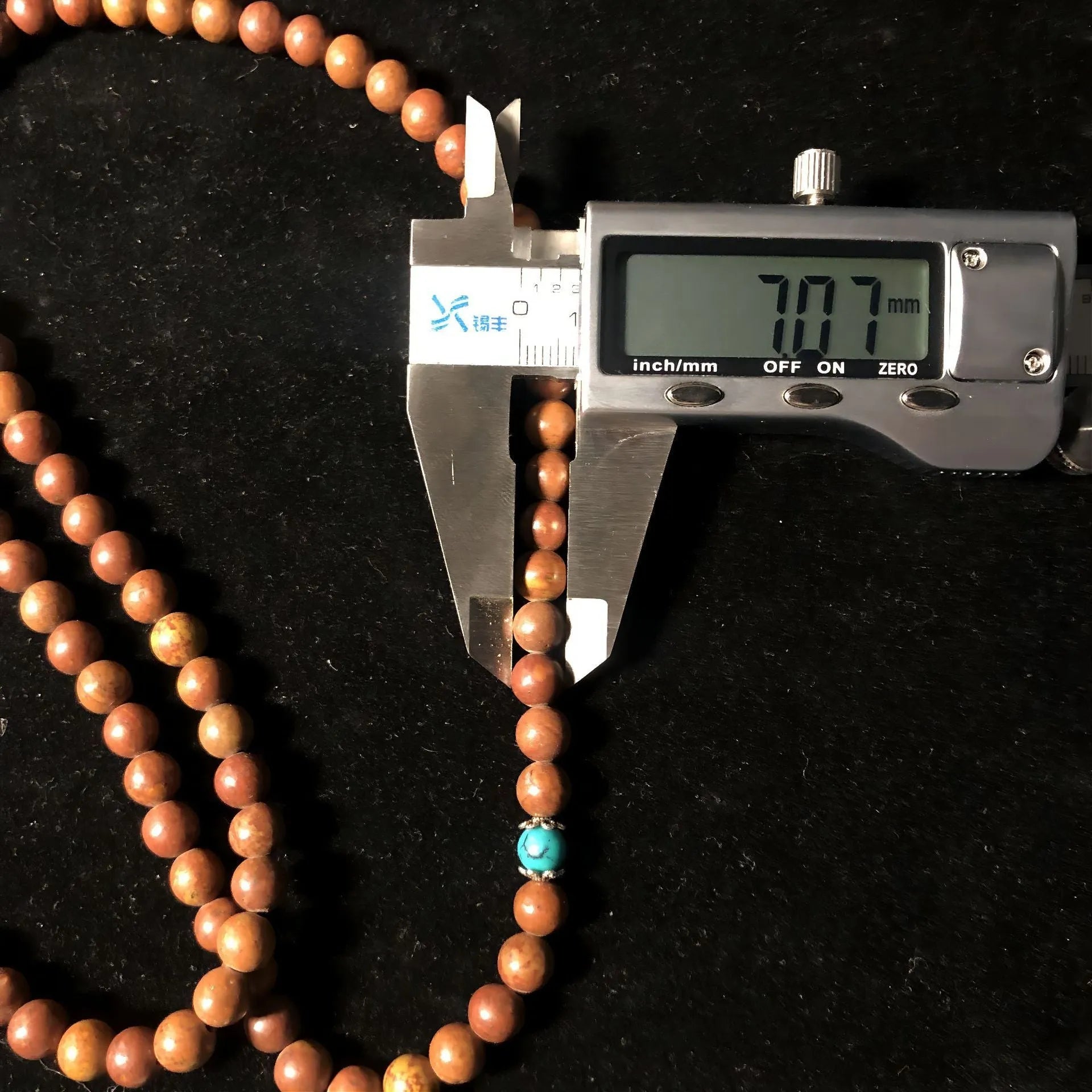 108 bead natural stone bracelet with hand-polished geometric lvzhu beads measuring 5-6mm diameter