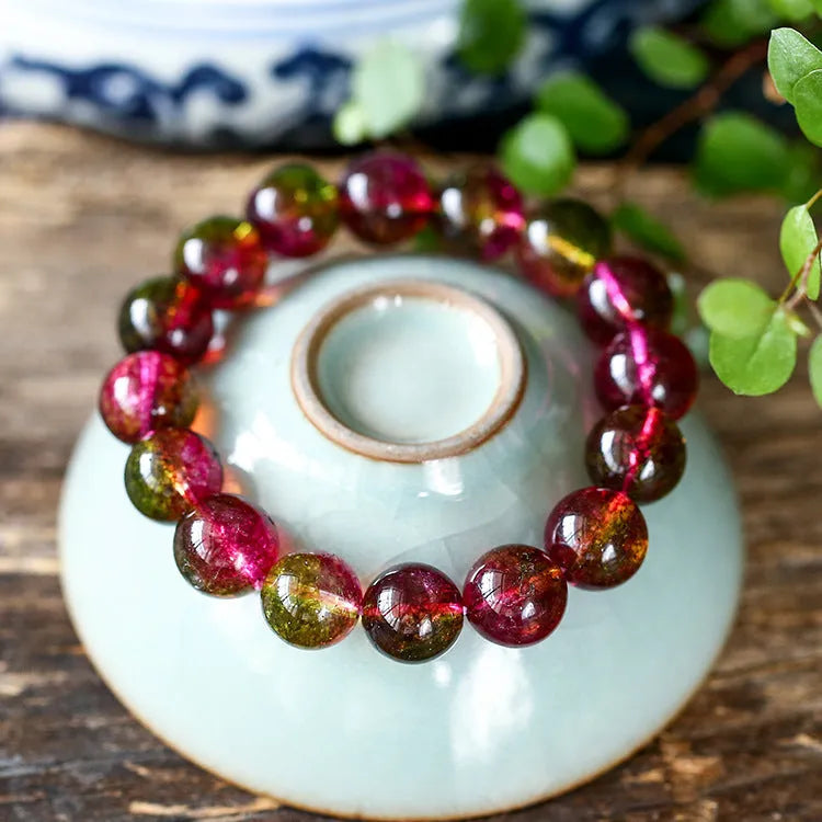 Women's watermelon crystal bracelet showing pastoral design elements on wrist