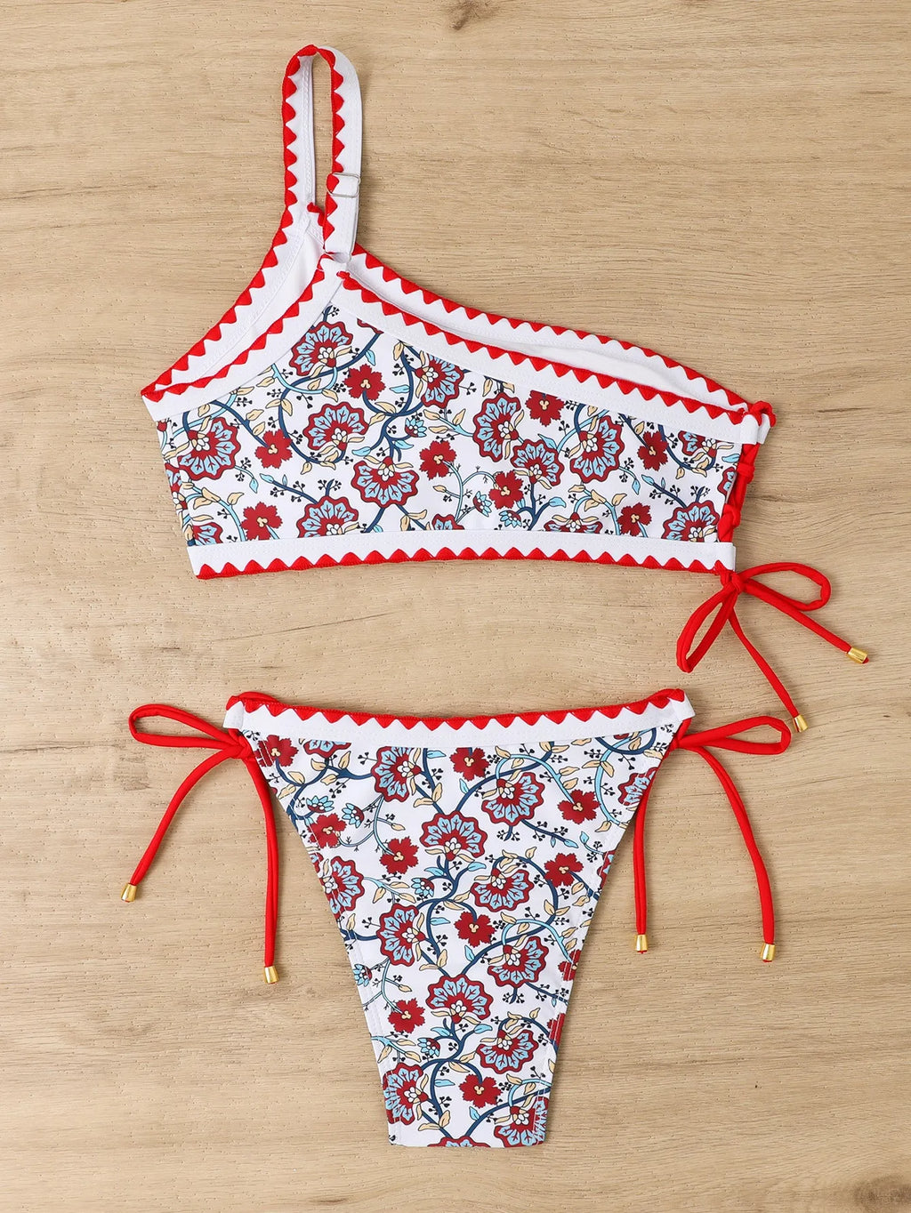 Women's blue floral one-shoulder bikini set with briefs bottom on mannequin
