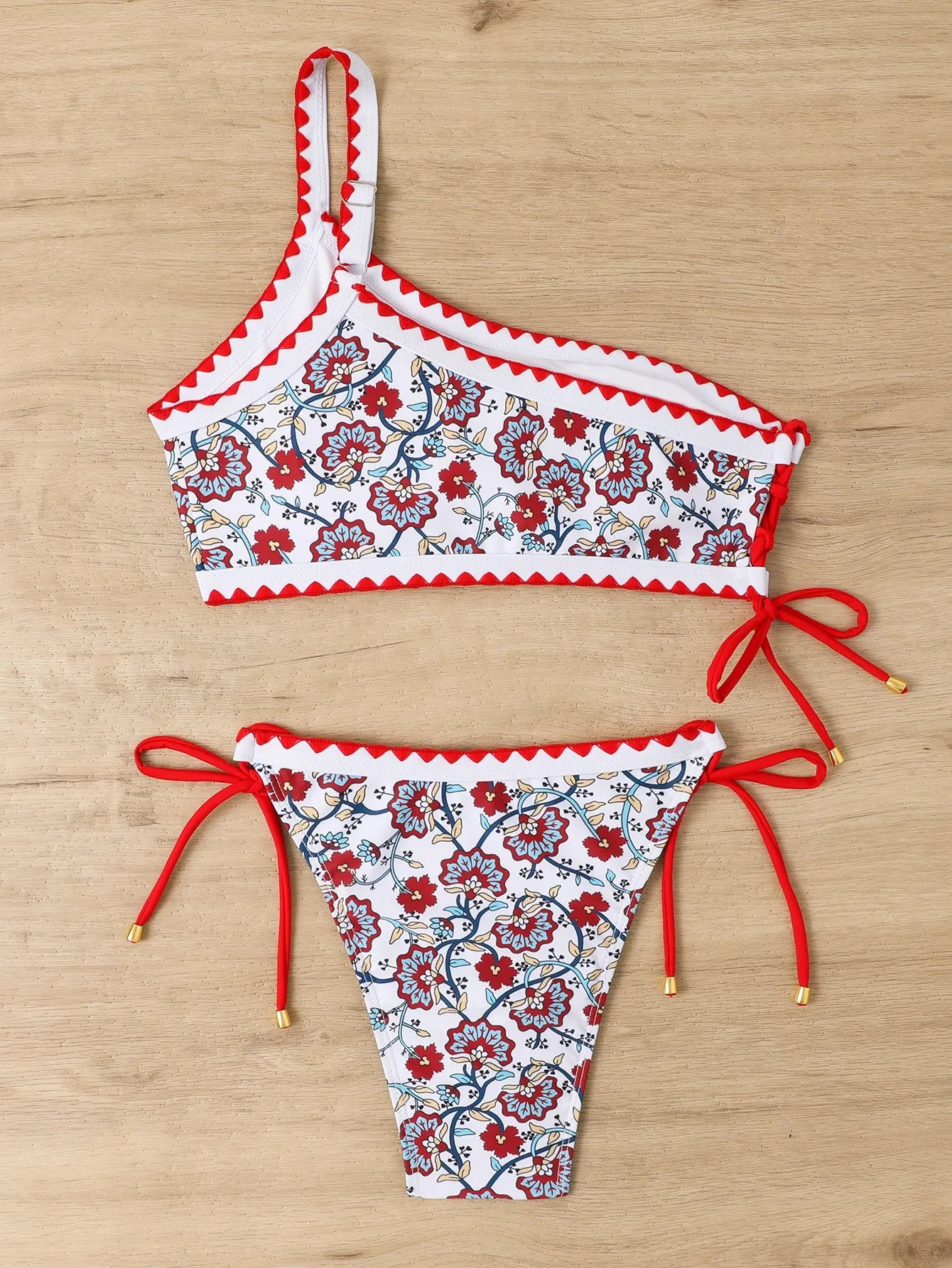 Women's blue floral one-shoulder bikini set with briefs bottom on mannequin