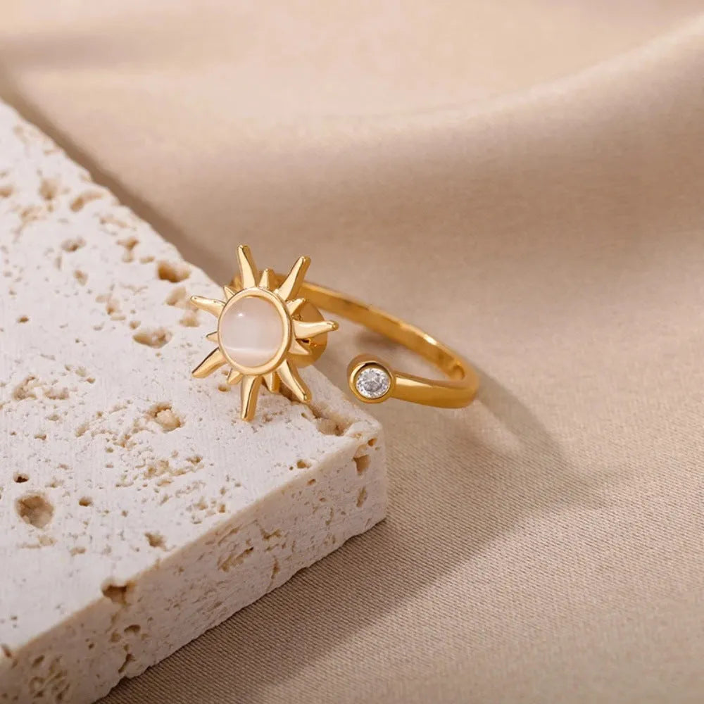 Adjustable copper decompression ring with rotatable element in gold or platinum finish