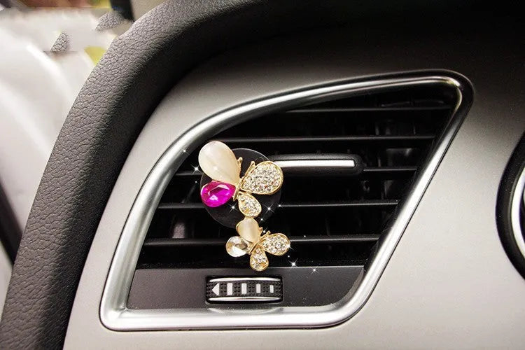 Cartoon alloy car air freshener clip with fruity liquid scent in a choice of twelve decorative styles