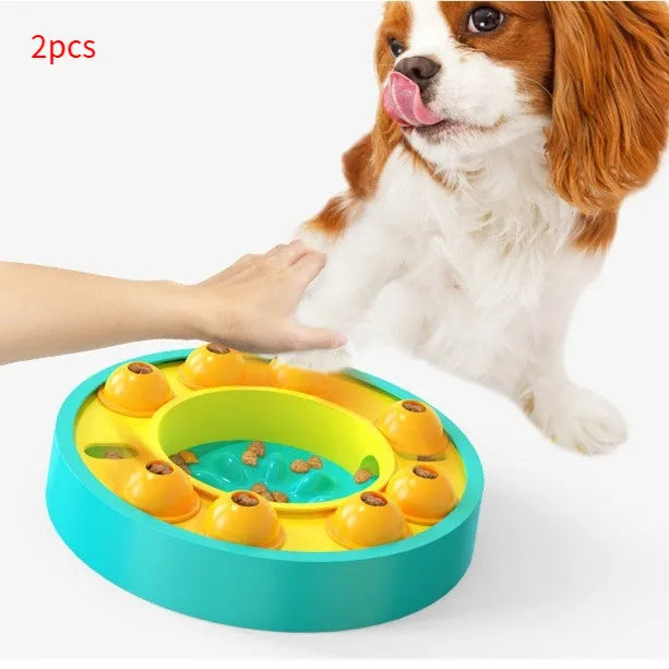 Square blue interactive dog puzzle bowl with a central feeding column and a turntable lid on a wooden floor.
