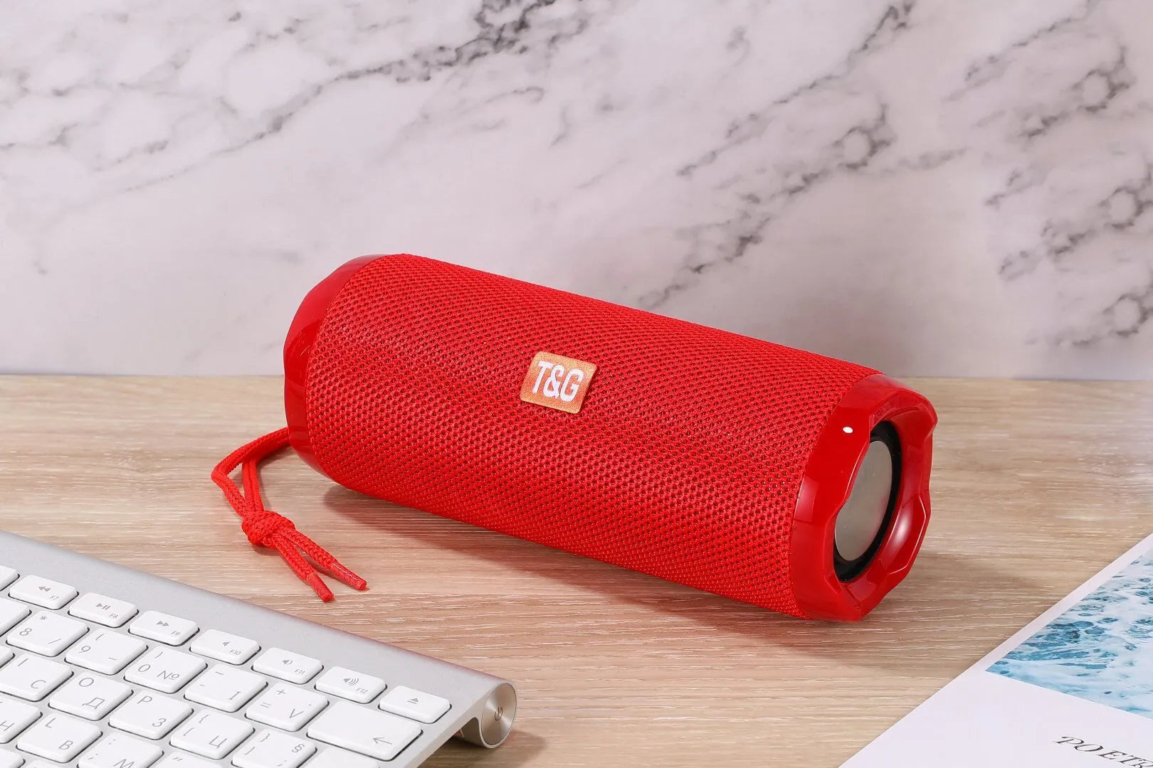 Fabric portable Bluetooth speaker with integrated card holder in multiple colour options.