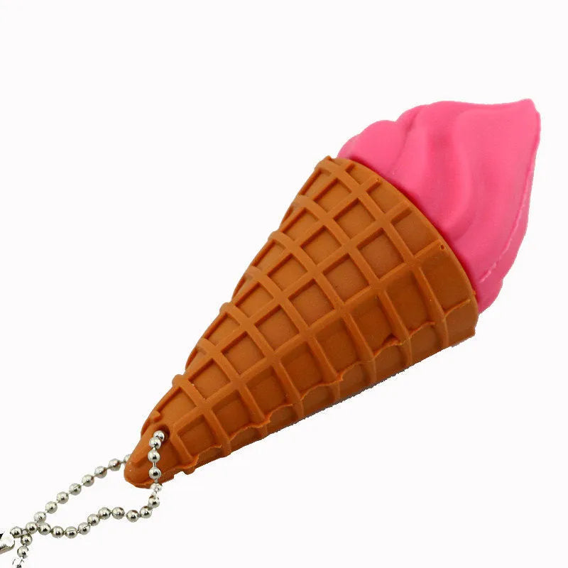 Pink plastic mini ice cream shaped USB flash drive on a white background.