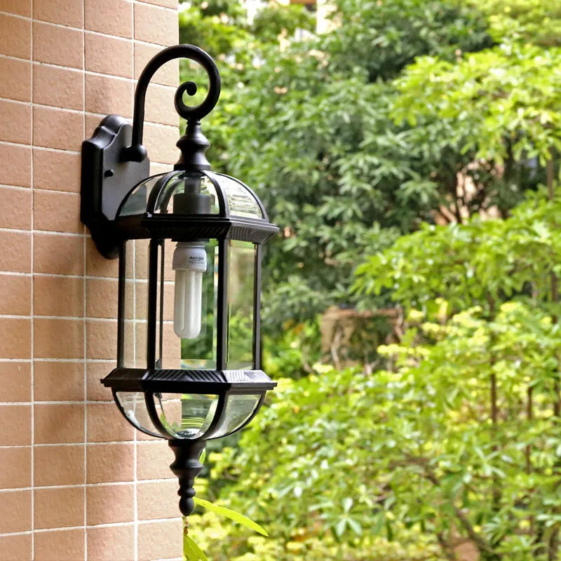 Gold aluminium outdoor waterproof wall lamp with a three-layer eight-inch frame mounted on a wall.
