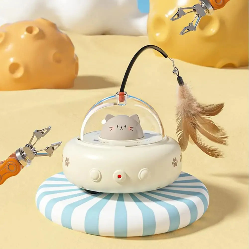 Electric cat interactive toy with pink feather wand and red light beam on a white floor