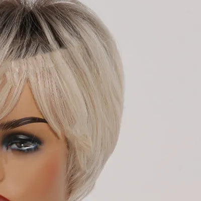 Short straight synthetic wig with ombre blonde colour, brown to gold gradient, 8-inch length and bangs on mannequin head