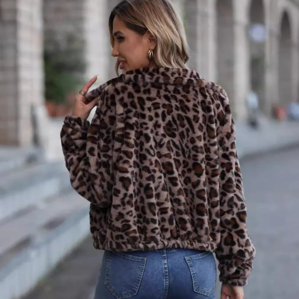 Women's loose fit leopard print plush coat with front zipper closure showing raglan sleeves