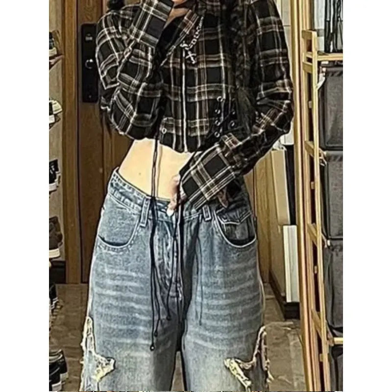 Blue high-waisted women's wide-leg denim jeans on a model, showing the straight-leg cut.