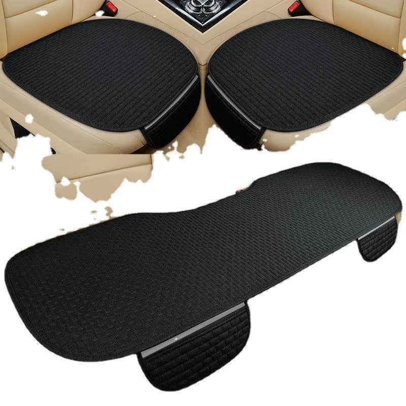Linen car seat cushion with hemmed edge in charm coffee colour, shown on a car seat.