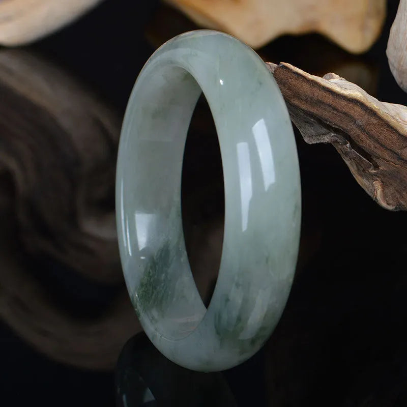 Natural Jinsi Jade Chinese style bracelet showing its solid construction on a neutral background.