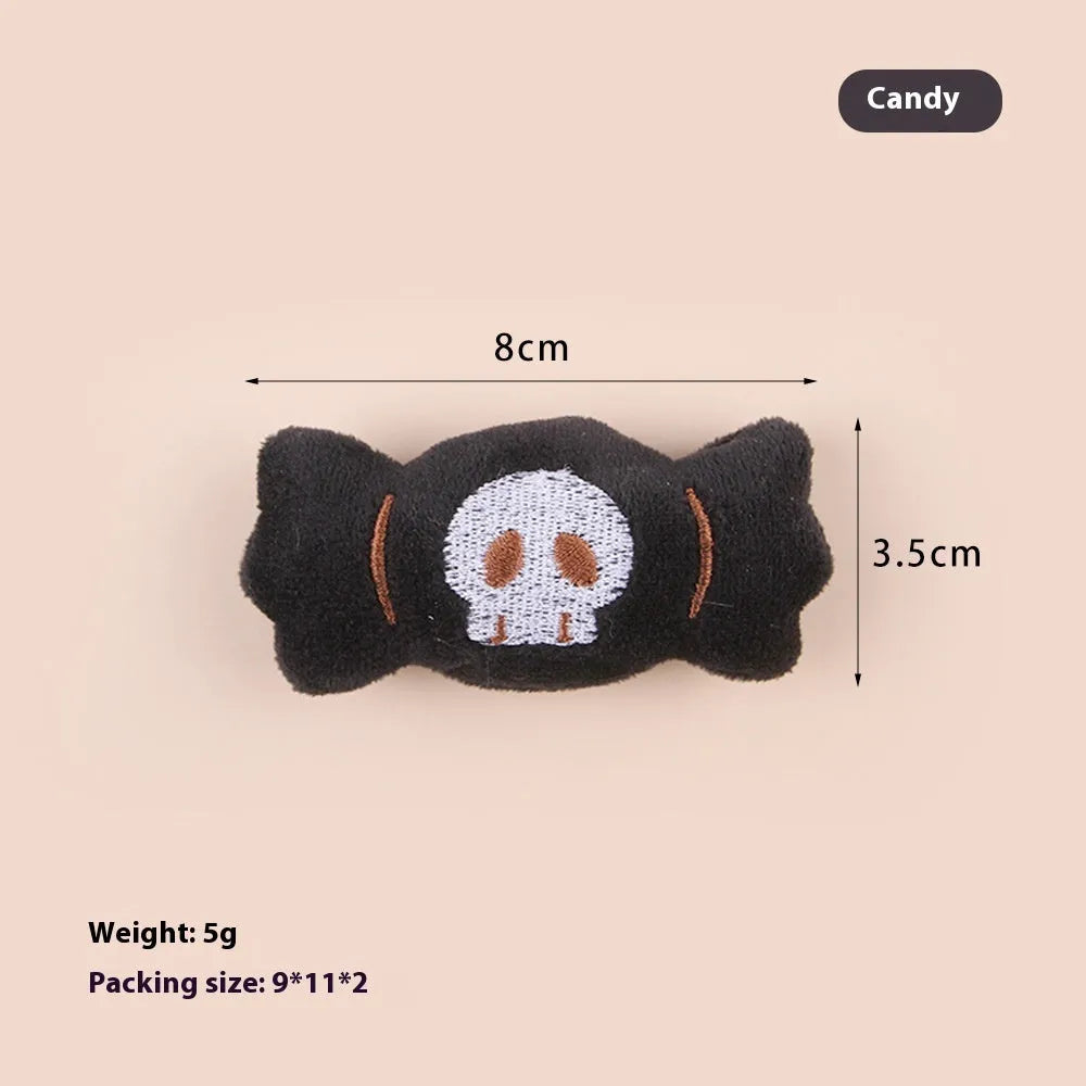 Small handheld cat teaser with plush candy and eyes attachments on wand