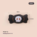 Small handheld cat teaser with plush candy and eyes attachments on wand