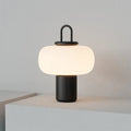 Minimalist glass bedside table lamp with warm light, Nordic style, 230x330mm, on wooden bedside table