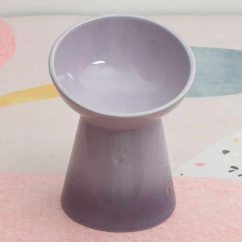 Black ceramic pet bowl with a high foot and neck protector to prevent tipping, shown with flat and slanted rim options.
