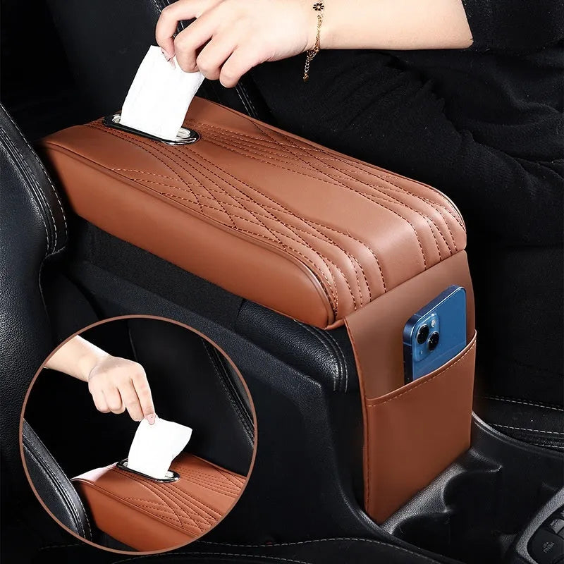 Black leather car armrest cover with angel pattern tissue pocket placed on a vehicle center console