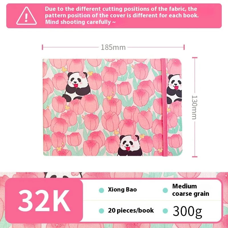 Feiluniao handmade fabric watercolour notebook with illustrated cover, open to show blank paper pages.