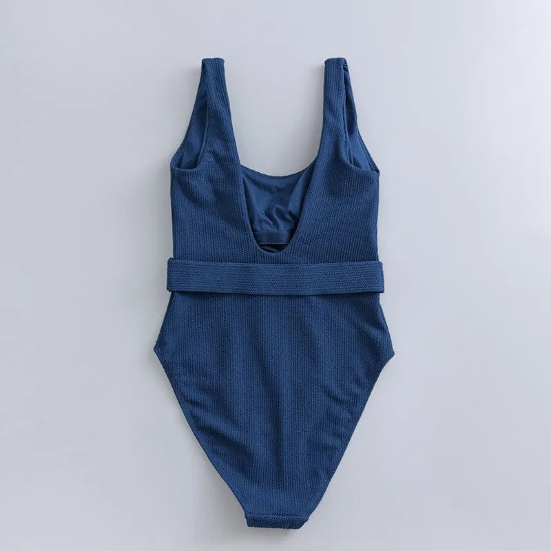 Navy blue solid colour women's one-piece slimming swimsuit with triangle shape and removable chest pads.