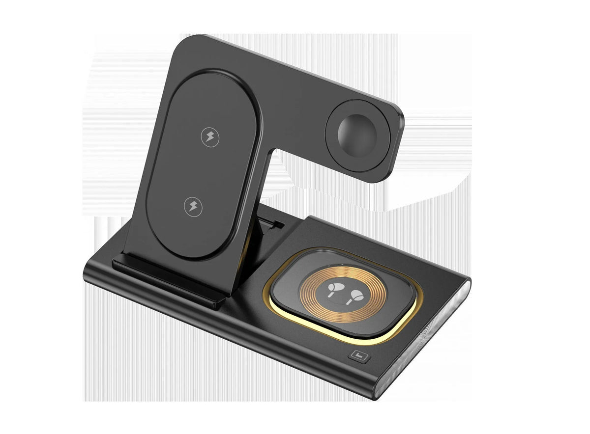 Black folding four-in-one wireless charger on a desk, showing its compact size and USB connection.