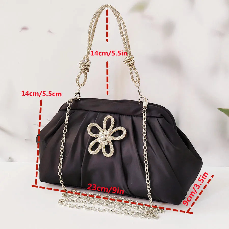 Women's black polyester messenger bag with chain detail, diamond patterns, and document organiser compartment