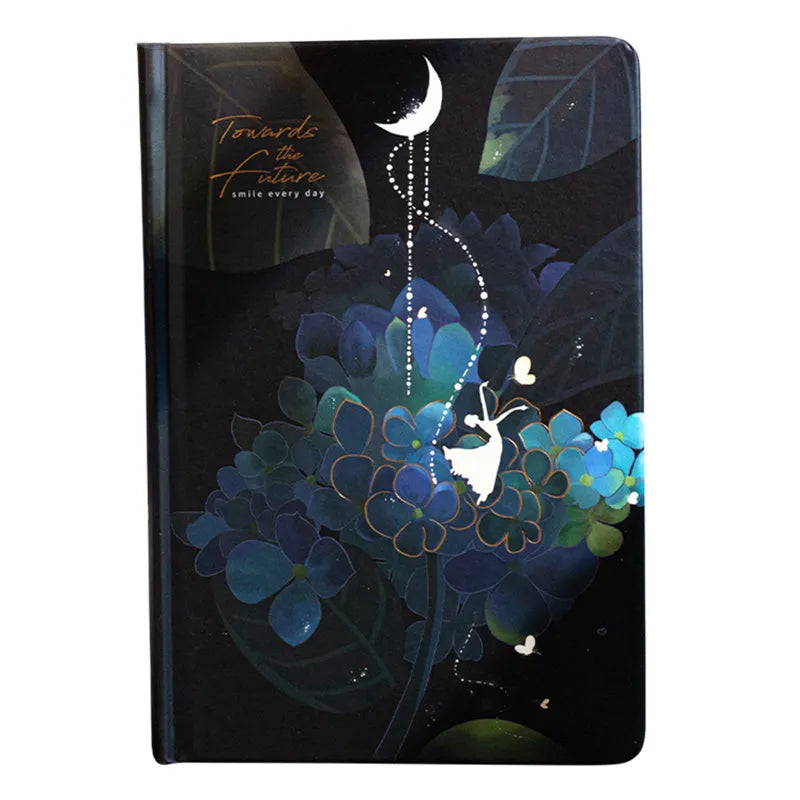 A5 notebook with luminous cover open to show colourful illustration pages, in Deep Blue, Gold, Light Blue, and Purple colour options.