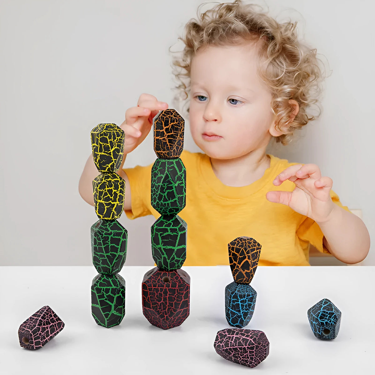 Kids rainbow assembling cactus wooden stacker building blocks on a light background