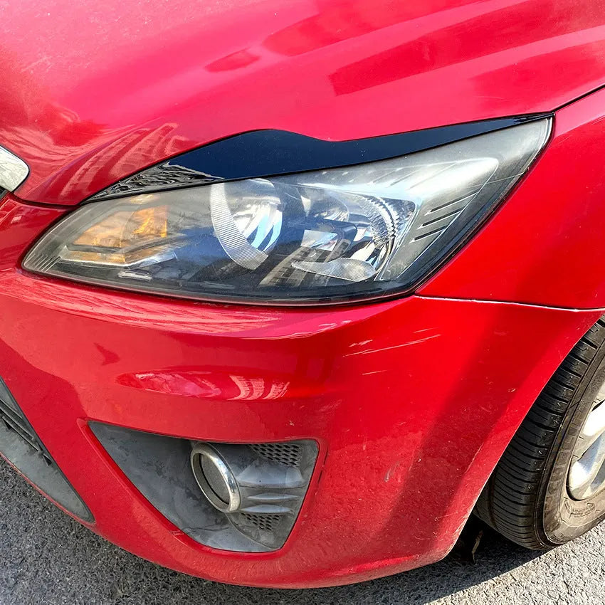 Ford Focus headlight sticker in carbon fibre pattern and piano black finishes for exterior decorative modification
