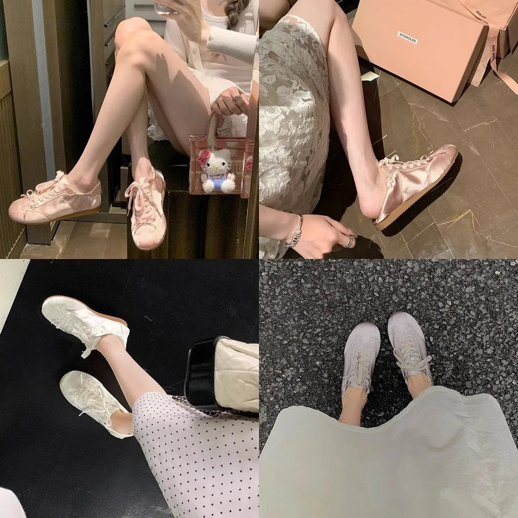 Women's champagne pink satin ballet flats with round toe and lace-up front, shown on a white background.