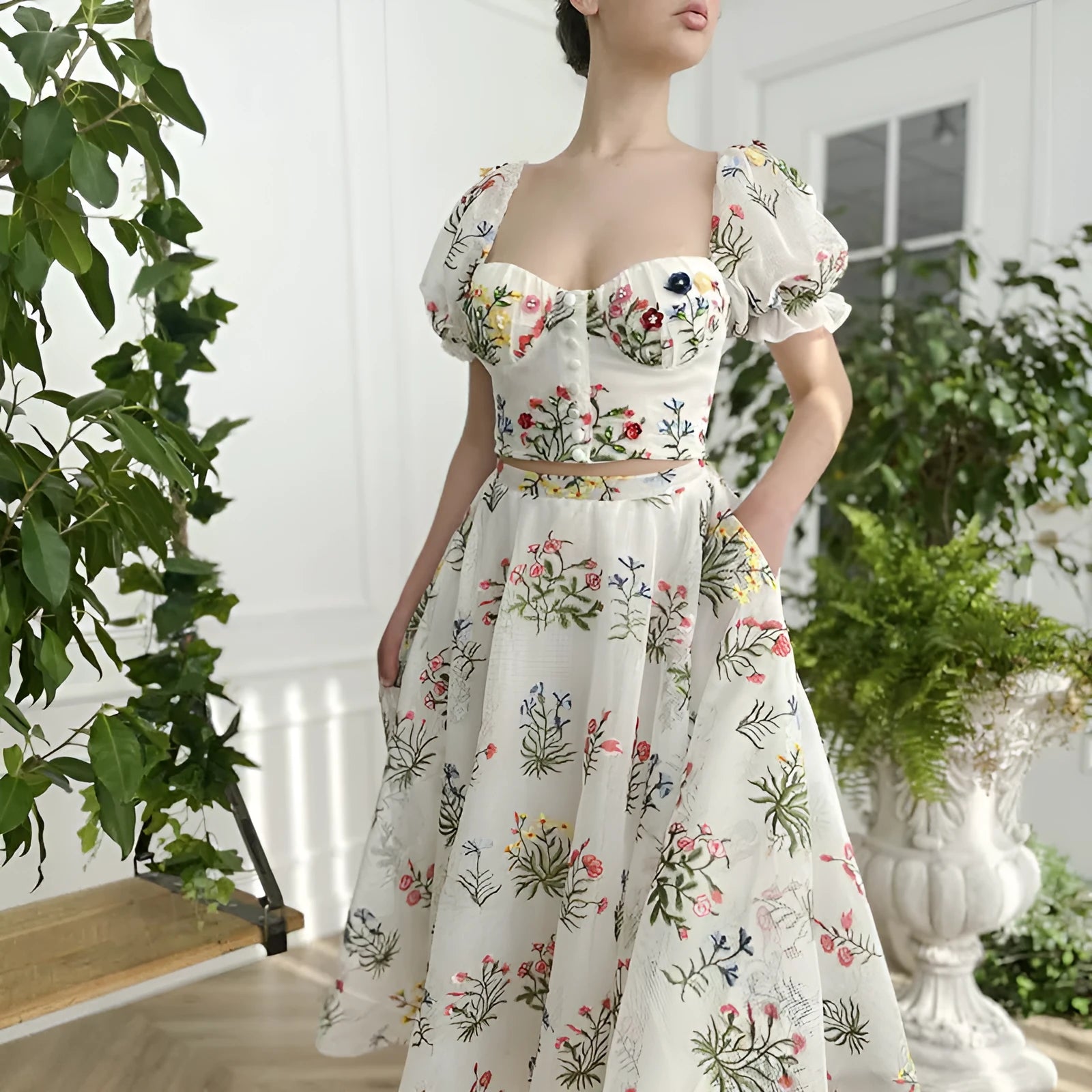 Women's fitted waist backless embroidered floral white two-piece set with mid-length skirt on white background