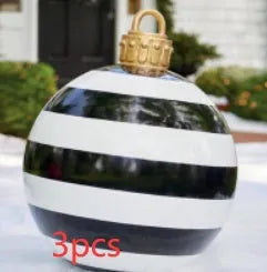 Large red and white striped inflatable Christmas ball ornament hanging on an outdoor tree