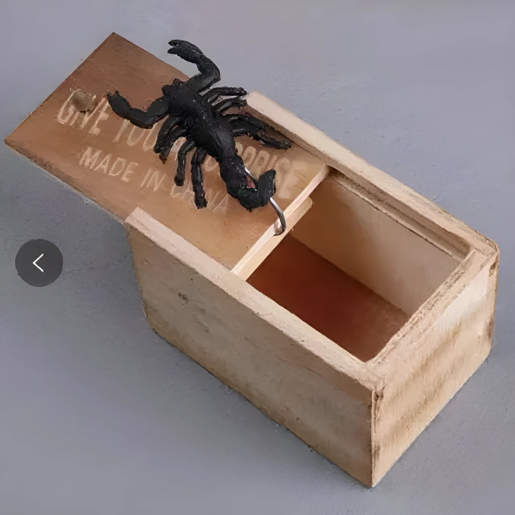 Camellia wood trick box with spider prank element on white background for scary spoof jokes