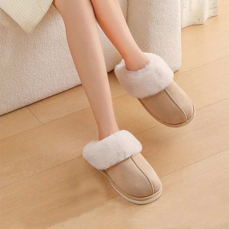 Brown plush indoor slippers with round toe, flat heel, and stitched detail on a PVC sole.