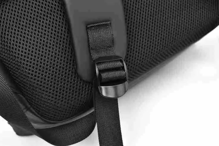 Men's waterproof backpack in black, blue or grey colour with PU leather construction and sewing thread detailing