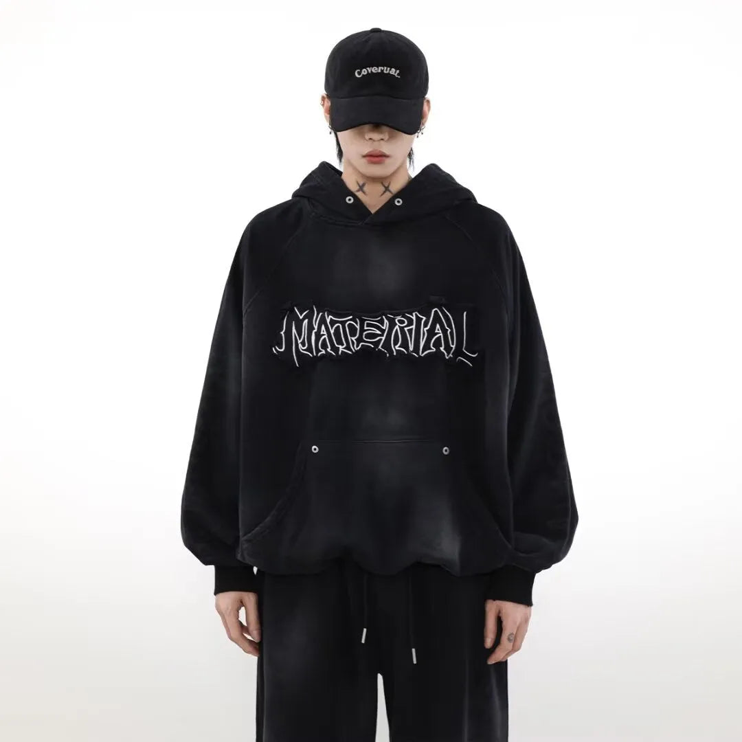 American vintage distressed graffiti hoodie in black loose fit pullover with long sleeves