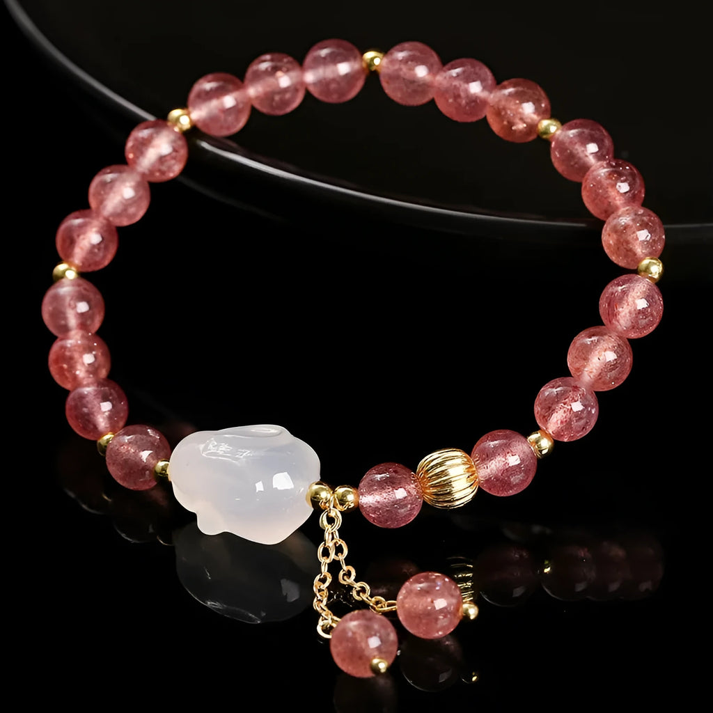 Handmade women's bracelet with natural strawberry quartz and agate 6mm round beads on a wrist.
