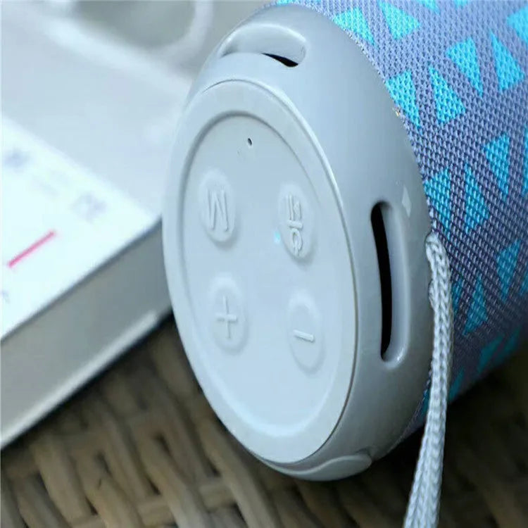 Wireless Bluetooth speaker in black, compact portable design with USB port and fabric grille