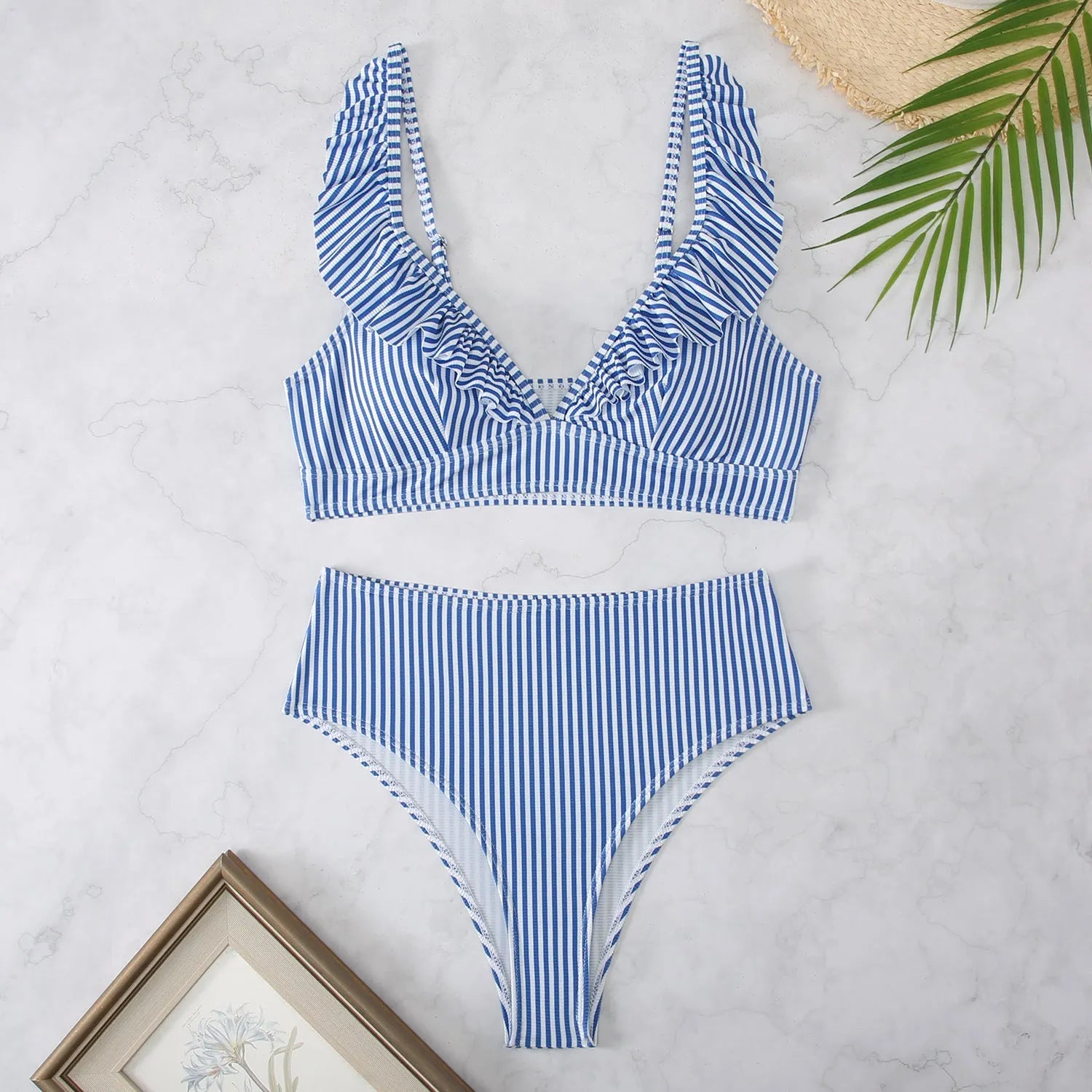 Retro striped split bikini swimsuit in black and white stripes on mannequin