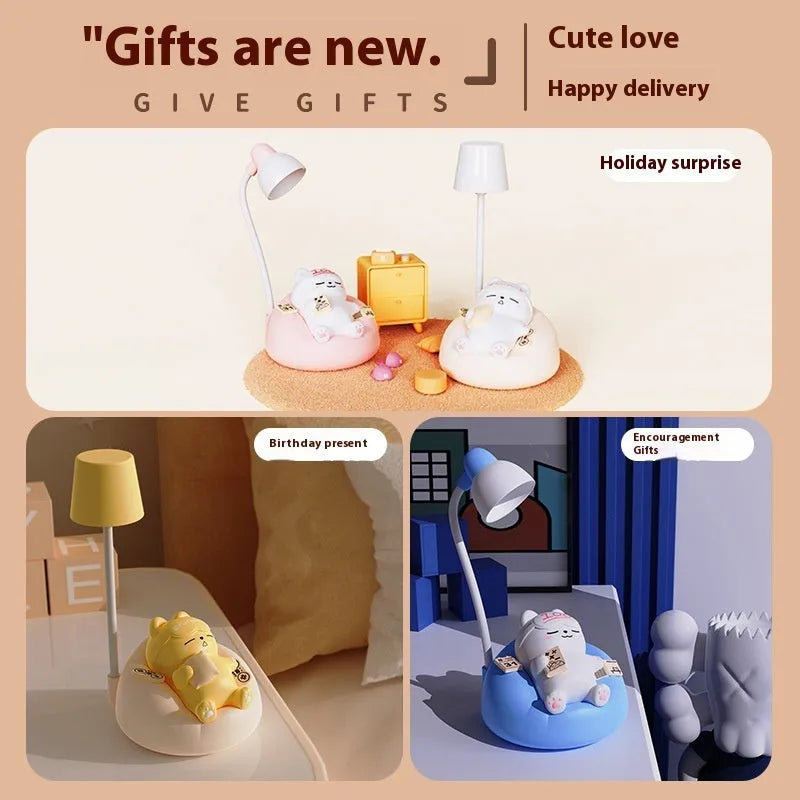 Sleeping cat shaped small night lamp in pink with USB charging cable on bedside table